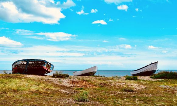 upturned fishing boats on heath near shore