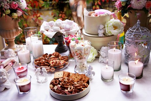 Table with candles beautifully covered for tea