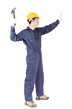 Young handyman in uniform standing with his hammer, Cutout isolated on white background