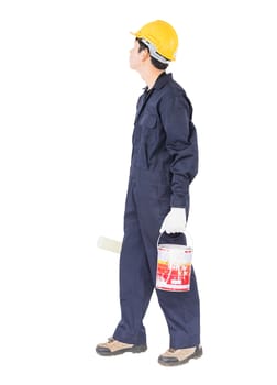 Young worker in uniform hold color can and using paint roller is painting invisible wall, isolated on white background cutout