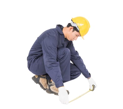 Young worker in unifrom with tape measure isolated on white background cutout