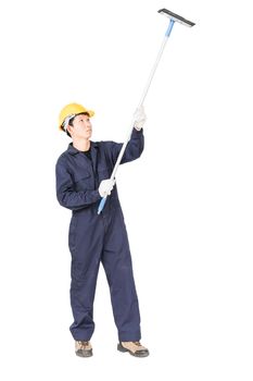 Young man in uniform hold mop for cleaning glass window, Cut out isolated on white background