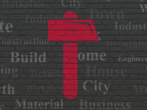 Constructing concept: Painted red Hammer icon on Black Brick wall background with  Tag Cloud