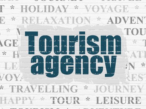 Tourism concept: Painted blue text Tourism Agency on White Brick wall background with  Tag Cloud