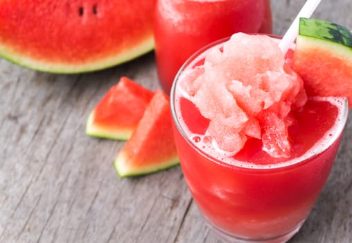 Closeup fresh watermelon smoothie in glass on wood table, Fruit drink for healthy concept