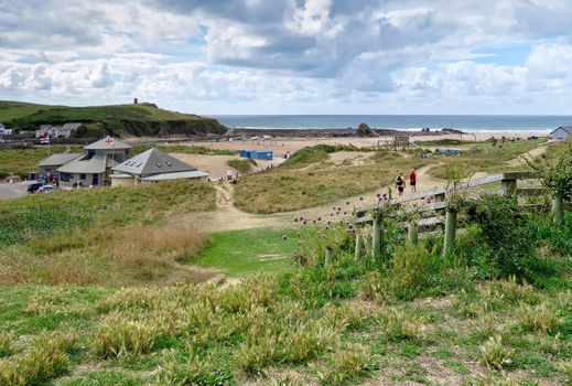 BUDE, CORNWALL/UK - AUGUST 12 : Walking to the Beach at Bude in Cornwall on August 12, 2013. Unidentified people