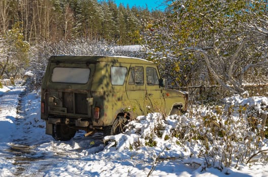 Unattended abandoned car in the woods on the nature