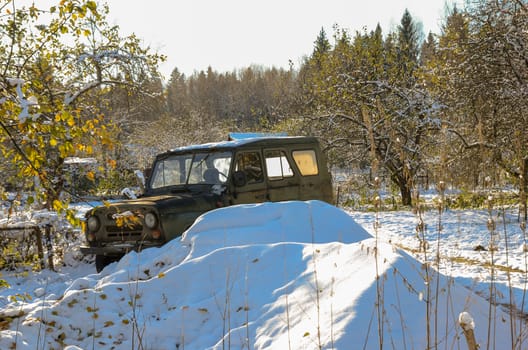 Unattended abandoned car in the woods on the nature