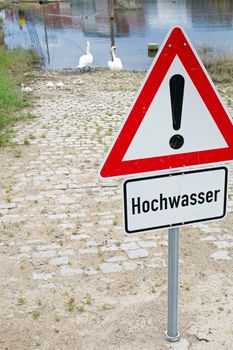 German general warning sign and additional sign with german text for flood