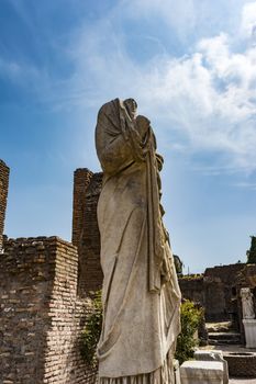 Roman statue at House of the Vestals in Roman Forum , Rome, Italy. The Roman Forum is one of the main tourist attractions of Rome.