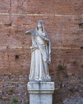 Roman statue at House of the Vestals in Roman Forum , Rome, Italy. The Roman Forum is one of the main tourist attractions of Rome.