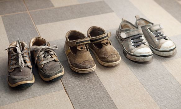 small shoes are in a row on floor