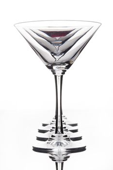 Glass with a red wine on a glass studio background
