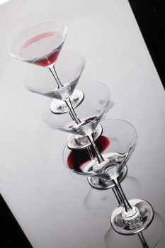 Glass with a red wine on a glass studio background