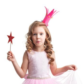 Little fairy girl in pink dress and crown with magic wand putting spell, isolated on white background