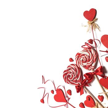 Valentines day decoration and heart shaped lollipops isolated on white background