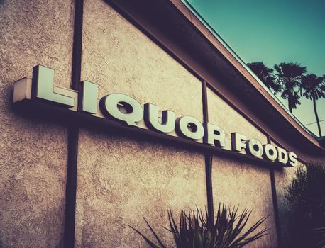 Retro Style Mid-Century Liquor Store Sign In A Desert Town In California