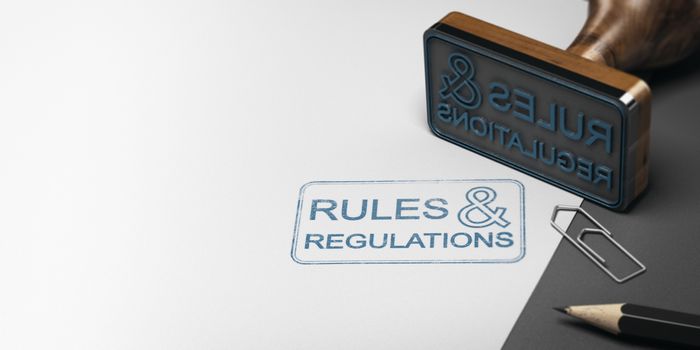 3D illustration of a rubber stamp with other office supplies and the text rules and regulations on a sheet of paper.