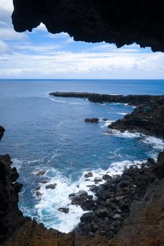 Cliffs and pacific ocean landscape vue from Ana Kakenga cave in Easter island, Chile