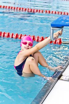 Photo of jumping girl in swimming pool