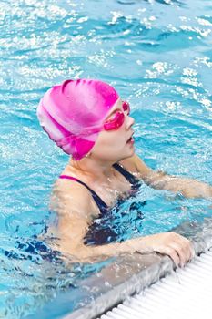 Photo of cute girl in swimming pool