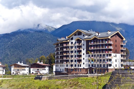 Panorama of Russian resort Roza Hutori international hotel in summer sunny day