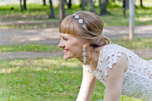 Beautiful portrait of bride with diadem in summer background