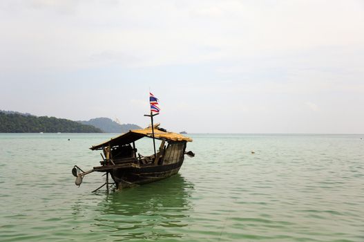 Local fishing boats are floating in the sea, Moken tribe.