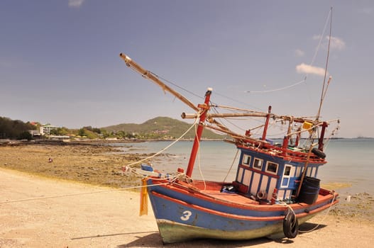 Fishing boats are parked on the beach, Si Chang Island, Chonburi, Thailand.