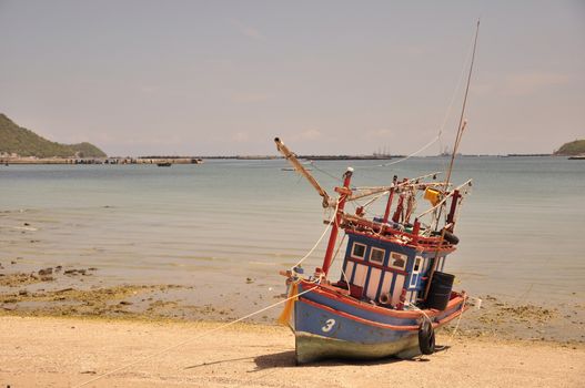 Fishing boats are parked on the beach, Si Chang Island, Chonburi, Thailand.