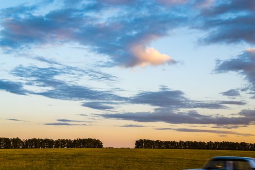 the road going car the evening sky moon night trip