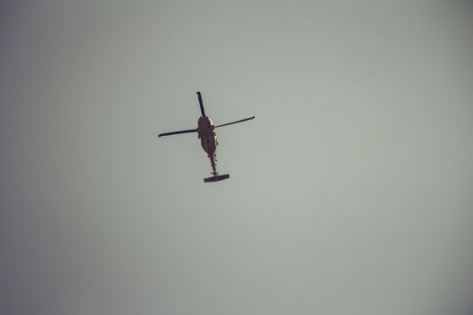 Israeli military UH-60 Black Hawk helicopter flying in the sky. Low angle view.