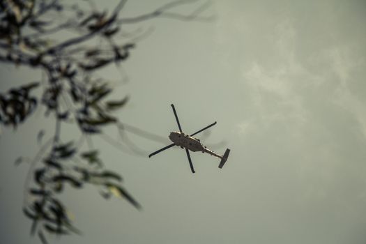 Israeli military UH-60 Black Hawk helicopter flying in the sky. Low angle view.