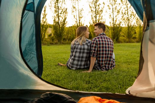 Shot of a happy couple camping on the nature