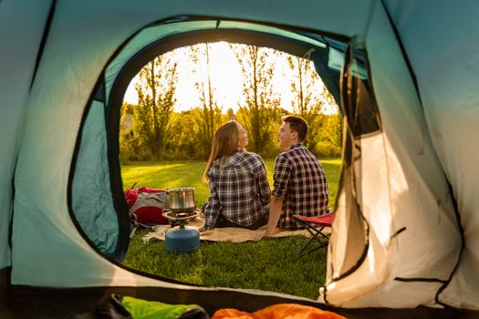 Shot of a happy couple camping on the nature