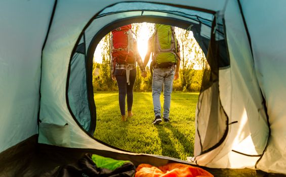 Shot of a happy couple camping on the nature