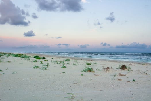 Sandy empty sea coastal seaview, cloudy colourful sunrise sky view