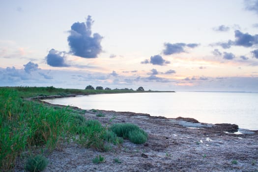 Sandy empty sea coastal seaview, cloudy colourful sunrise sky view