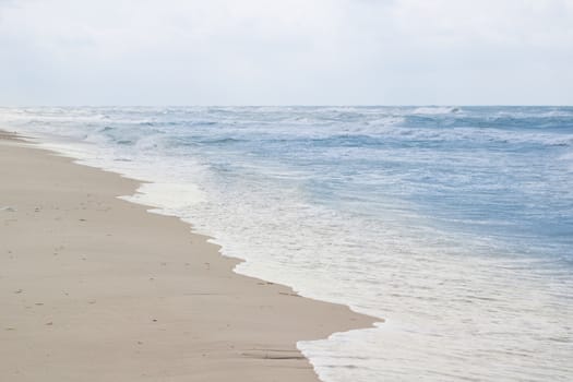Sandy empty sea coastal seaview, cloudy colourful sunrise sky view