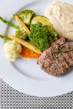 grilled fillet steak served with grilled vegetable and mash potato