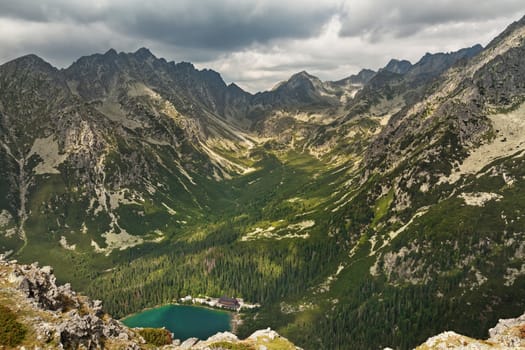 Alpine lake Popradske pleso in the morning with a great view on Tatra mountains.