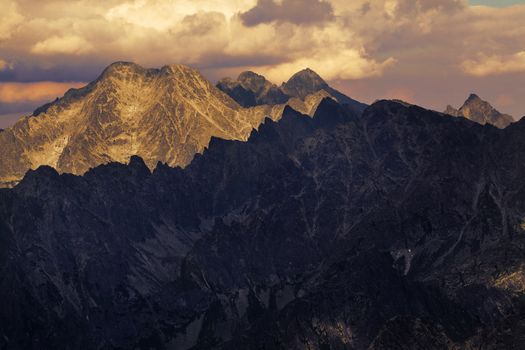 View on high rocky peak in Tatra Mountains. We can see Lomnicky Stit peak faf far awey