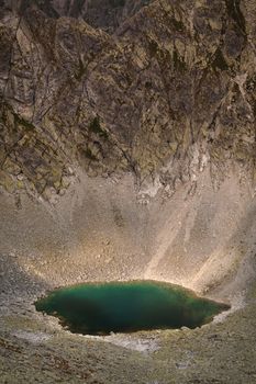 Photo of lake Capie pleso in Mlynicka dolina, view from Bystra Lavka in High Tatra mountains.