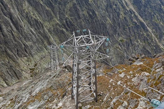 Electric power line in extremely high rocky mountains in High Tatra mountains, Slovakia, Europe