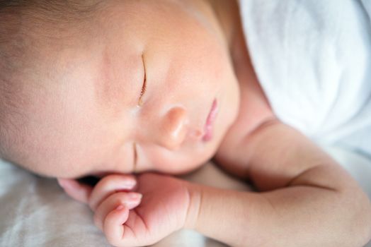 Close up Little Asian newborn baby boy 7 days, sleeps.