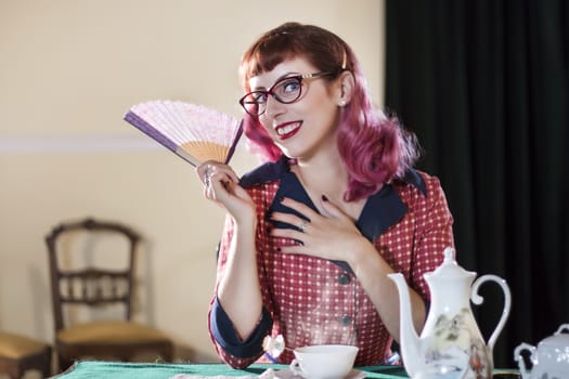 Vintage themed tea girl on a old retro house.