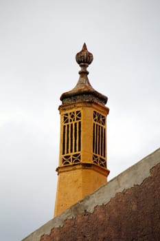 Beautiful yellow typical chimney of the Algarve region, Portugal.