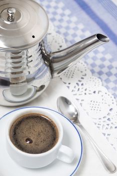 Composition of the classic coffee cup espresso on a table.