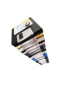 Vertical pile of computer floppy disks with usb disk isolated on a white background.