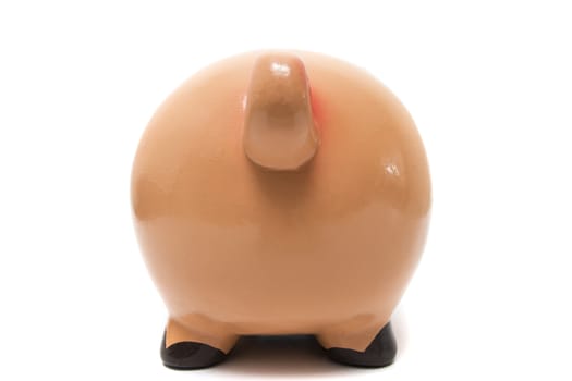 Close up view of a cute pink piggy bank isolated on a white background.